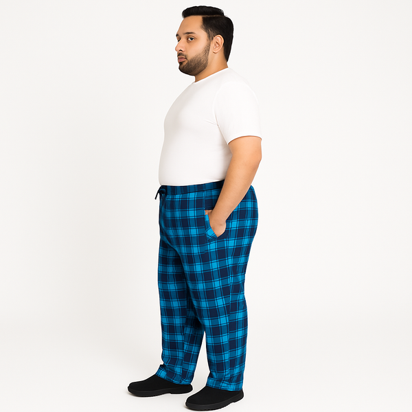 Blue plaid plus-size jersey lycra trousers with drawstring waistband, laid flat on white background