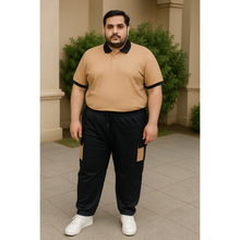 Plus-size Pakistani man wearing a tan and black cargo tracksuit, featuring a polo jersey top and terry pants with side pockets