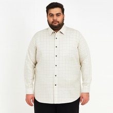 Plus-size Pakistani man wearing off-white formal shirt with black grid checks