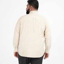Off-white plus size button-down shirt with beige and rust pinstripes, long sleeves – laid flat on wooden background
