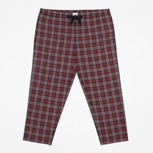 Red and grey plaid plus size lounge trousers with black drawstring, laid flat on a white background