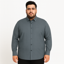 Plus-size Pakistani man wearing steel grey formal shirt with long sleeves