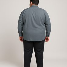 Plus-size Pakistani man wearing steel grey formal shirt with long sleeves
