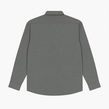 Plus-size Pakistani man wearing steel grey formal shirt with long sleeves