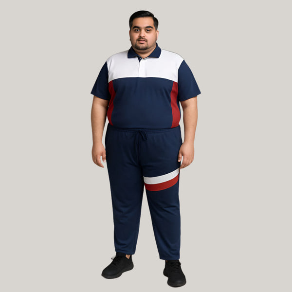 Plus-size man wearing tri-tone navy, white, and red tracksuit – front view, polo shirt and jersey trouser