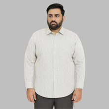 Plus-size Pakistani man wearing white shirt with small black grid check pattern